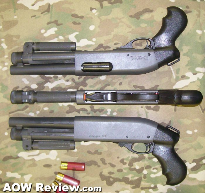 Three short-barrel shotguns with shells laid out on camo