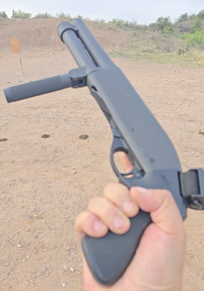 Compact Serbu pump shotgun with a vertical foregrip