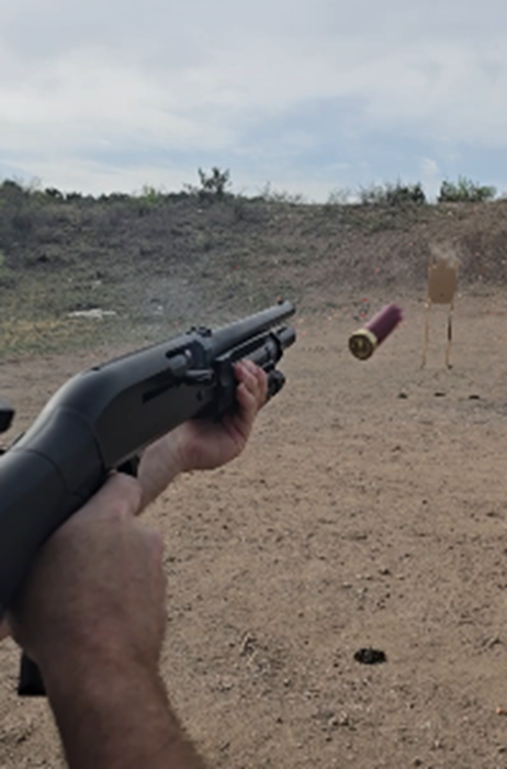 Firing a pump shotgun with a spent shell ejecting